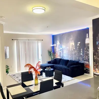 a living room with a couch and a table at Magic Splash Getaway in Santa Clarita