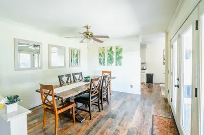 a dining room with a table and chairs at Swinton in North Hills