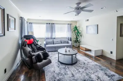 a living room with a chair and a couch at Swinton in North Hills