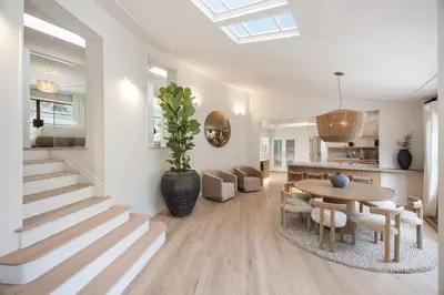 a living room with a table and a dining room at Villa Avra by Stay Awhile Villas in Los Angeles