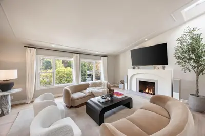 a living room with a couch and a fireplace at Villa Avra by Stay Awhile Villas in Los Angeles