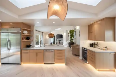 a large kitchen with wooden cabinets and a ceiling at Villa Avra by Stay Awhile Villas in Los Angeles