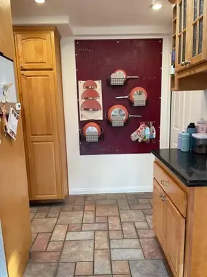 a kitchen with a wall with plates on it at Cozy Beach Bungalow- Happynest in Long Beach