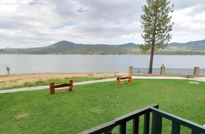 a park with benches and a view of a lake at Getaways at Lagonita Lodge in Big Bear Lake