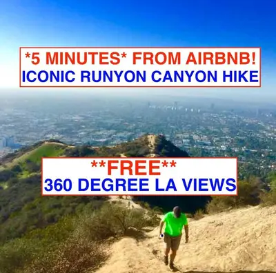 a man walking down a dirt trail on a mountain at Hollywood Hills Spa Retreat Oasis with Tree Top Views, Private Jacuzzi Style Tub, Steam Room, Magical Half Acre Acre Garden and Patio, Free Parking for 2 cars, in LA's most Serene, Central Desirable Area in Los Angeles