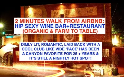 a sign for a wine bar restaurant at night at Chic Private Hollywood Hills Guest Suite Oasis with Tree-Top Views, Outdoor Living Room, Only 2 Minutes from Hollywood Boulevard in Los Angeles