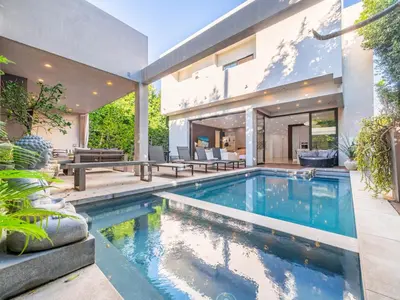 a swimming pool in the backyard of a house at Sycamore Villa in Los Angeles