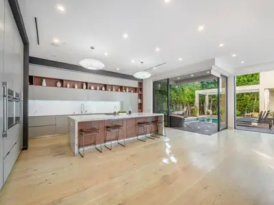an open kitchen with a counter and a kitchen island at Sycamore Villa in Los Angeles