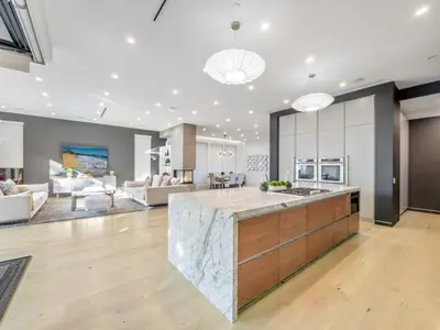 an open kitchen and living room with a large island at Sycamore Villa in Los Angeles