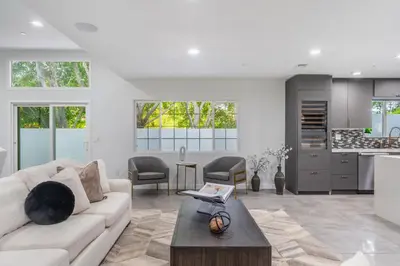 a living room with a couch and a table at Fulton Villa in Garnsey