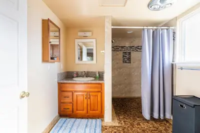 a bathroom with a sink and a shower at King Studio with Self Check-In in Ontario