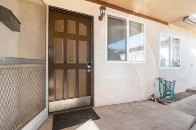 a front door of a house with a window at King Studio with Self Check-In in Ontario