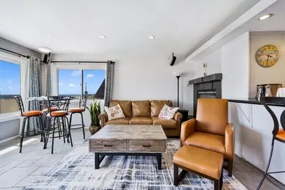 a living room with a couch and a table at Awesome On The Strand, Hermosa Beach Property in Hermosa Beach