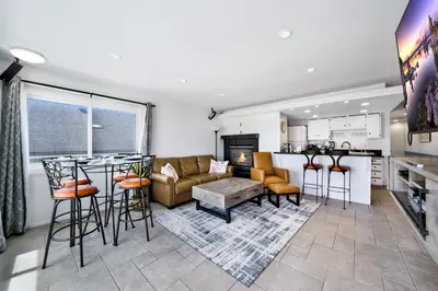 a kitchen and living room with a couch and a table at Awesome On The Strand, Hermosa Beach Property in Hermosa Beach