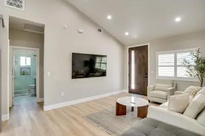 a living room with a couch and a table at 2 Mi to Disneyland Home with Furnished Patio! in Anaheim