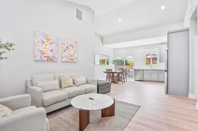 a living room with a couch and a table at 2 Mi to Disneyland Home with Furnished Patio! in Anaheim