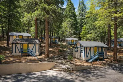 a group of tiny houses in a forest at Arrowhead Ranch Retreat and Conference Center in Lake Arrowhead
