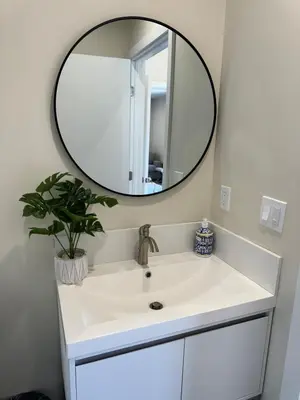 a bathroom with a white sink and a mirror at cozy & Elegant Torrance Apartment with balcony in Torrance