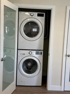 a washer and dryer in a room at cozy & Elegant Torrance Apartment with balcony in Torrance
