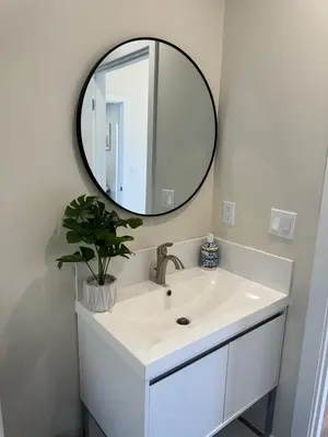 a bathroom with a white sink and a mirror at cozy & Elegant Torrance Apartment with balcony in Torrance