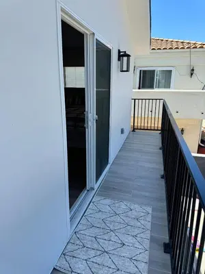 a balcony of a house with a glass door at cozy & Elegant Torrance Apartment with balcony in Torrance