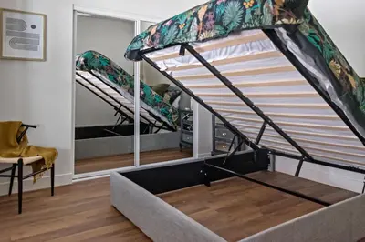 a bunk bed in a room with a window at All New Apt Mins Beach, Downtown & Convention Ctr LB ADU in Long Beach