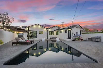 a house with a swimming pool in the yard at Bellaire in Garnsey