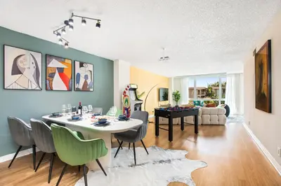 a dining room and living room with a table and chairs at Ocean 2min, Romantic Bath, Cinema, Pool, Arcade in Marina del Rey