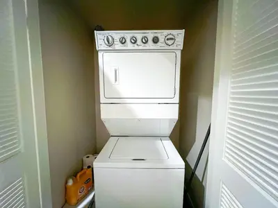 a white stove top oven in a small kitchen at Mid Century With Pool GYM and Parking 10min to Cedars in Los Angeles
