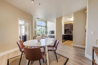 a dining room with a table and chairs at 2BD Marina Condo Near Venice Beach, Pool & Free Parking in Los Angeles