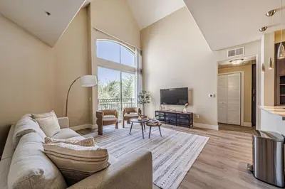 a living room with a couch and a tv at 2BD Marina Condo Near Venice Beach, Pool & Free Parking in Los Angeles