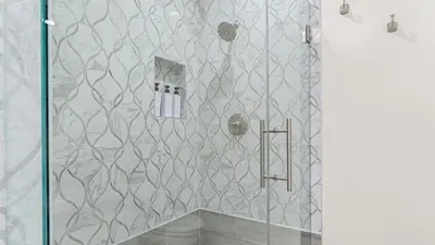 a shower with a glass door in a bathroom at Beach Retreat with Oceanfront Balconies Direct Beach Access Pacific Coast Outlook by AvantStay in Malibu Beach