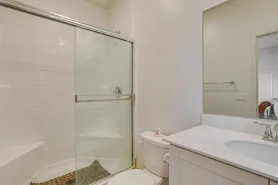 a bathroom with a shower and a toilet and a sink at Cozy Desert Sanctuary 9 Mi to Mojave Narrows Park! in Victorville