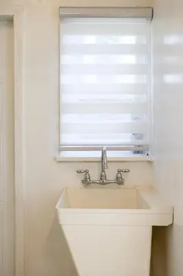 a sink in a bathroom with a window at Near LA Cozy Home with Full Kitchen & Laundry in San Gabriel