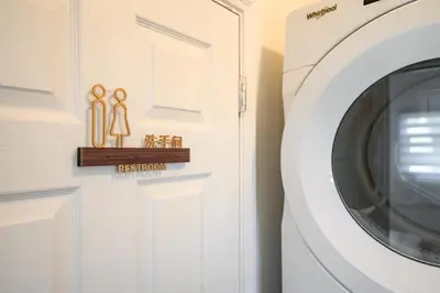 a white laundry room with a white washing machine at Near LA Cozy Home with Full Kitchen & Laundry in San Gabriel