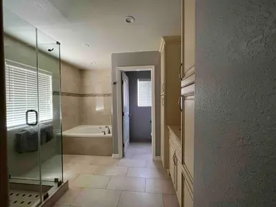 a bathroom with a shower and a bath tub at Beautiful and cozy! in Palmdale