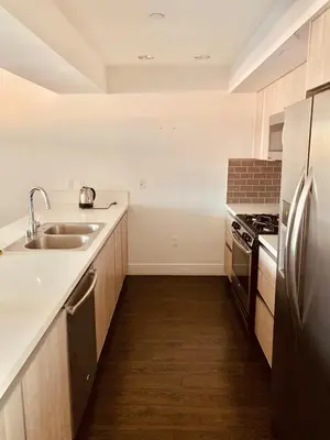 a kitchen with a sink and a refrigerator at Western Sierra Vista in Los Angeles