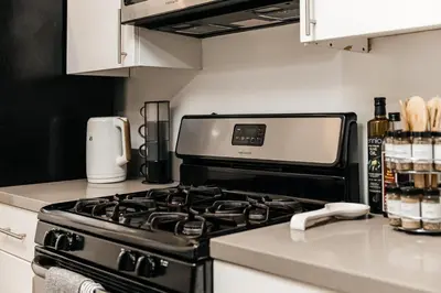 a kitchen with a stove and a counter top at Cozy 2BD apartment in Los Angeles