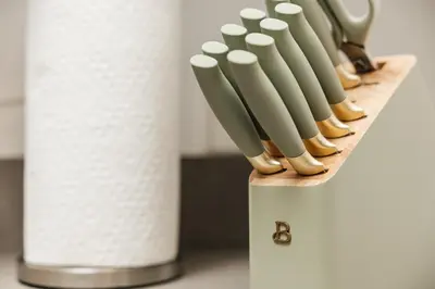 a shelf with a roll of toilet paper and a group of knives at Cozy 2BD apartment in Los Angeles