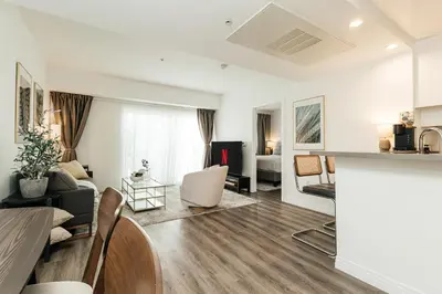 a living room with a couch and a table at Cozy 2BD apartment in Los Angeles