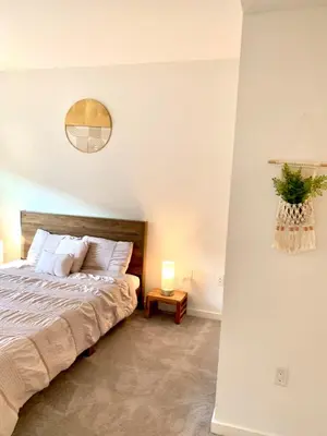 a bedroom with a bed and a mirror on the wall at Luxury Hollywood Stay Beautiful 2Beds2Baths in Los Angeles