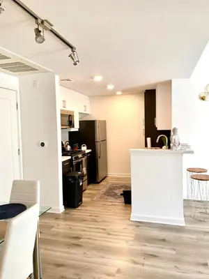 an open kitchen and living room of an apartment at Luxury Hollywood Stay Beautiful 2Beds2Baths in Los Angeles