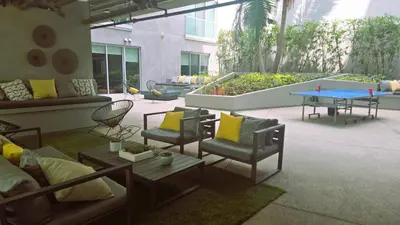 a patio with a table and chairs and a table and a ping at Modern Boutique Living in Culver City in Los Angeles