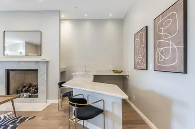 a living room with a counter and a fireplace at Spacious Hollywood Private Villa with 7 Bedrooms and Pool in Los Angeles