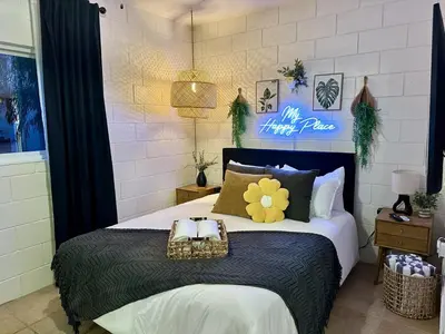 a bedroom with a large bed with two baskets on it at 4 Min Walk to Beach and Restaurants in Manhattan Beach