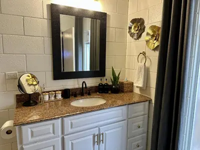 a bathroom with a sink and a mirror at 4 Min Walk to Beach and Restaurants in Manhattan Beach
