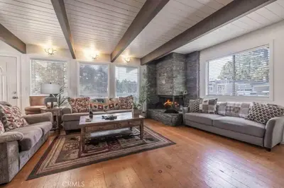 a living room with couches and a fireplace at Navigate Stays Best Location Pet Friendly Games in Big Bear City
