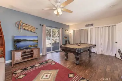 a living room with a pool table and a flat screen tv at Navigate Stays Best Location Pet Friendly Games in Big Bear City