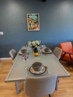 a table with a bottle of wine and chairs at Echo Lake view condo - newly renovated - centrally located in Los Angeles