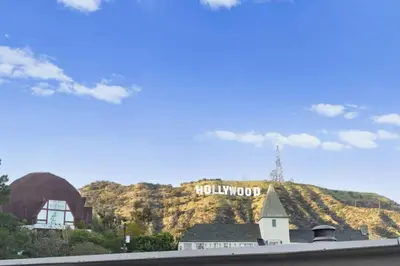 a building with a hollywood sign on top of a mountain at Coldwater Canyon ADU in Los Angeles